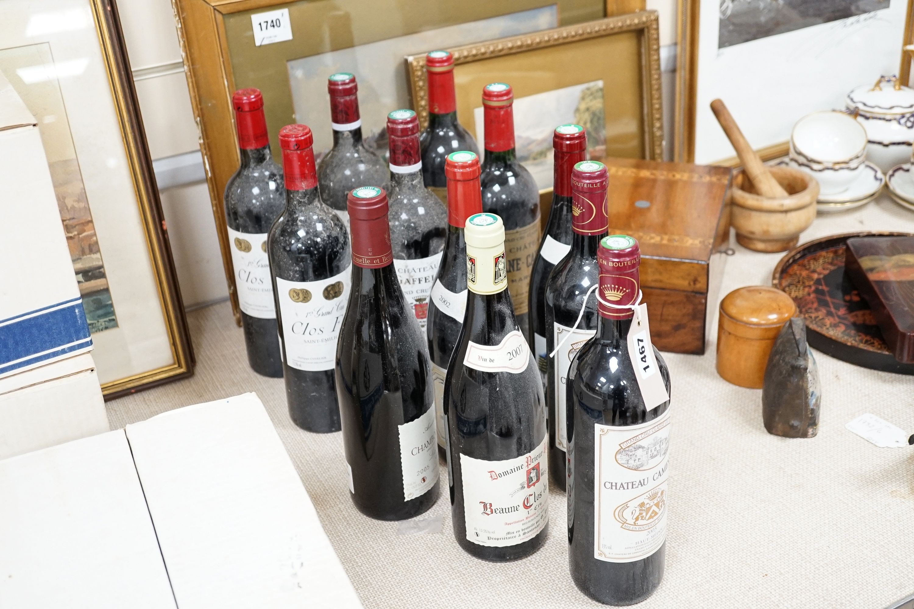 Twelve various bottles of red wine